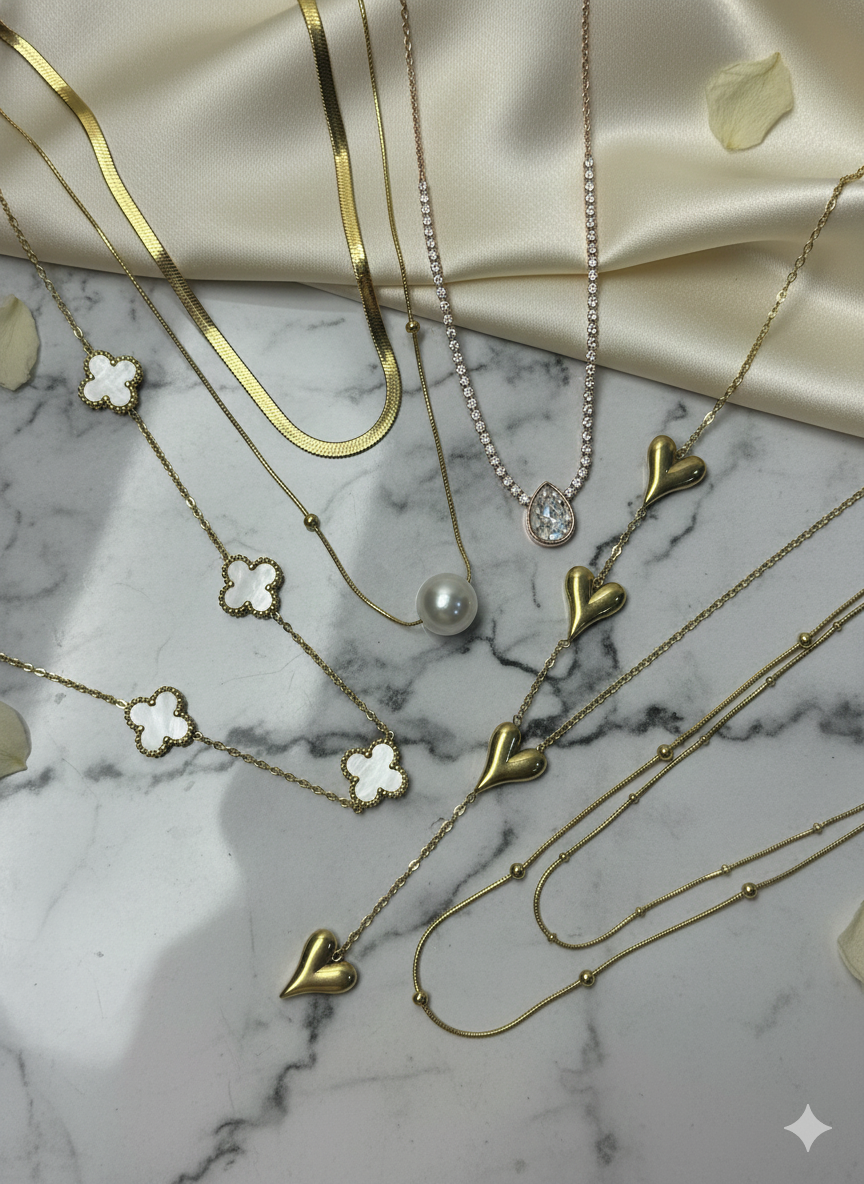 An elegant necklace featuring a refined design with a smooth, polished finish. It sits gracefully around the neckline and is designed to complement both everyday outfits and special occasions.