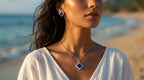 Woman wearing a necklace and earrings on a beach