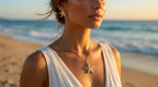Woman on a beach wearing starfish jewelry with a blurred ocean background