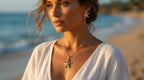 Woman on a beach wearing starfish jewelry with ocean in the background