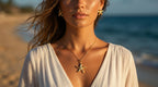 Woman wearing a starfish necklace on a beach