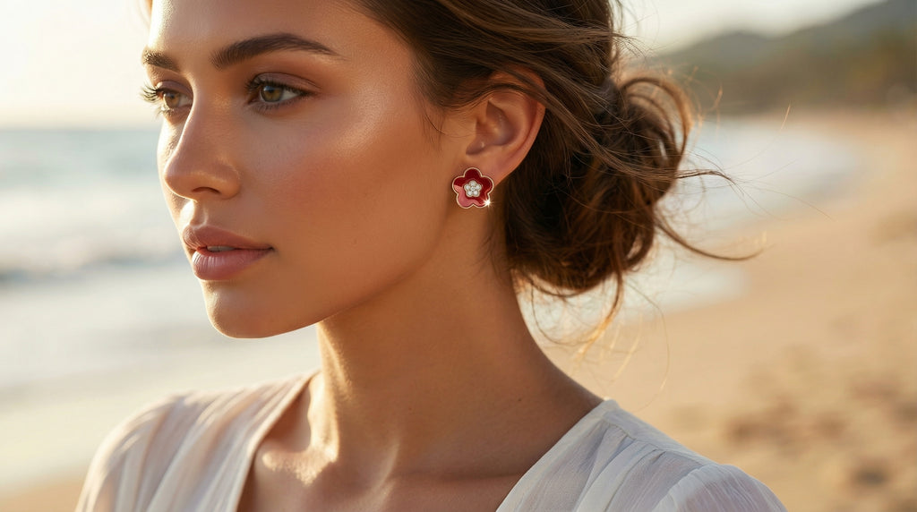 Woman wearing earrings with a blurred beach background