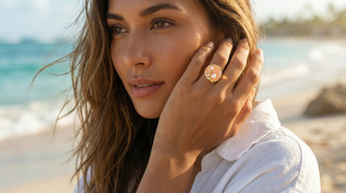 Woman on a beach wearing a diamond ring