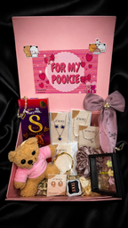 Luxury gift hamper for girlfriend filled with teddy bear, jewelry, chocolate, and personalized items.