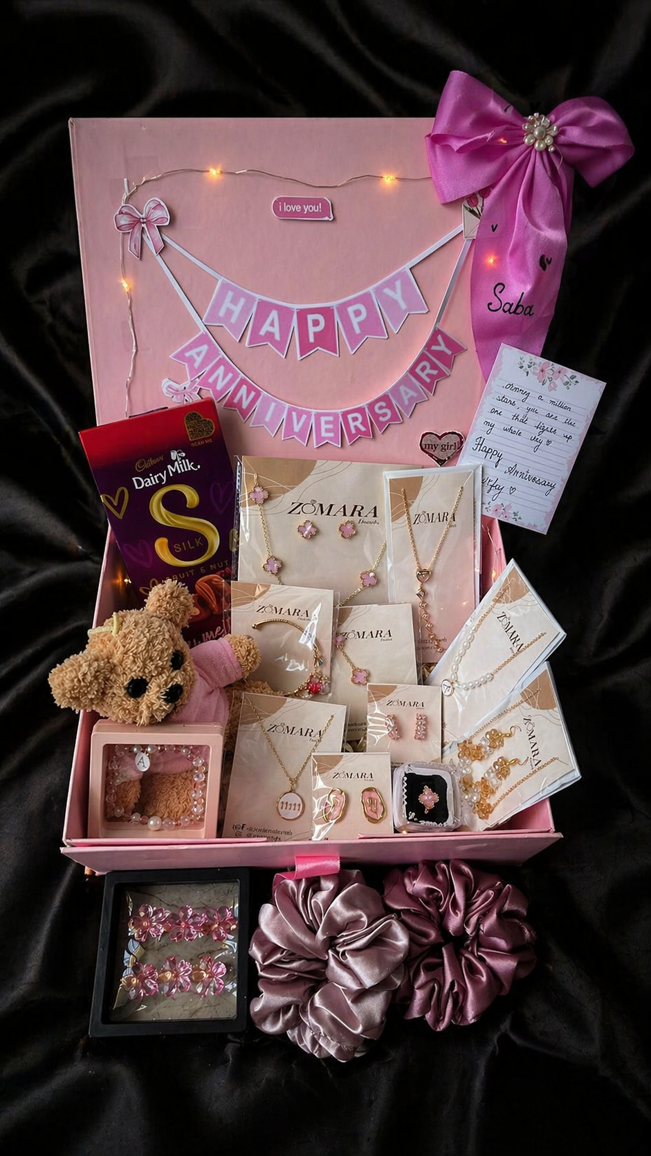 Sweetheart Premium Gift Hamper for anniversary featuring jewelry, chocolates, teddy bear, and decorative items.