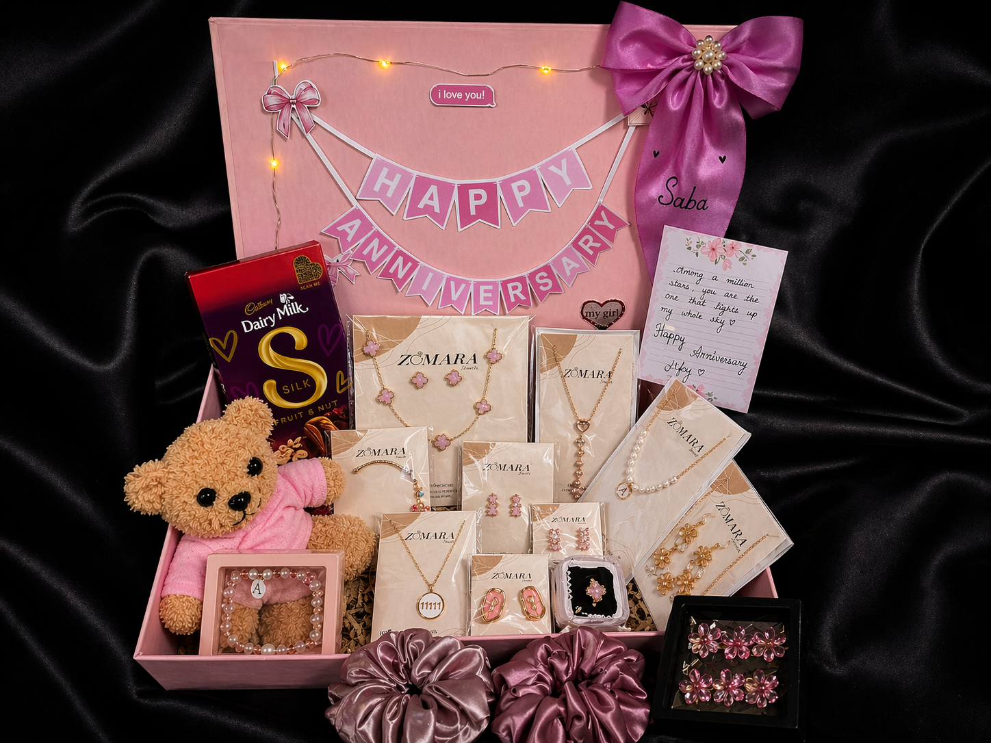 Sweetheart Premium Gift Hamper for anniversary featuring jewelry, chocolates, teddy bear, and decorative items.