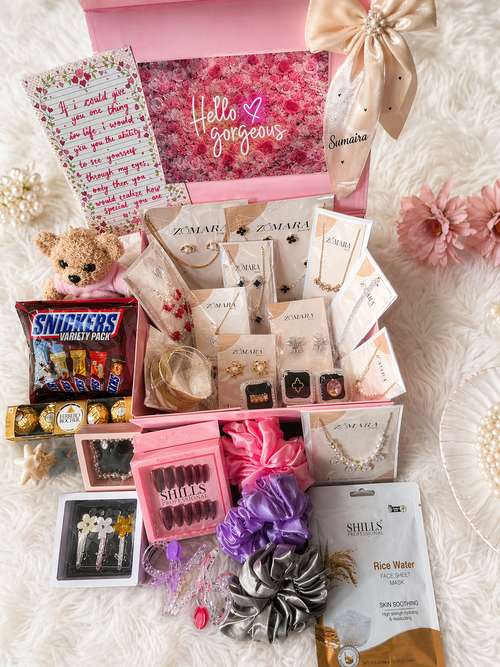 Blush Luxury Gift Hamper box featuring jewelry, snacks, and beauty products for a premium gift experience.