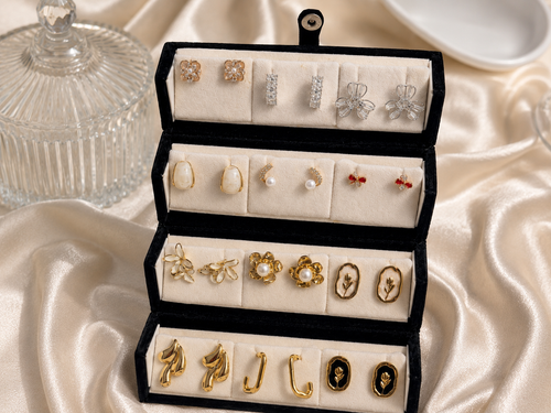 12-pair vintage floral and pearl gold-tone earring set displayed in an elegant gift box