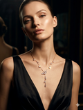 Woman wearing a black dress and a necklace with a dark background