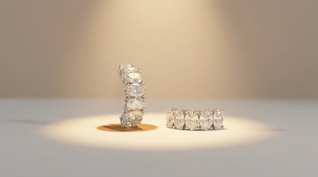 Two diamond rings on a light surface with a neutral background