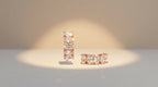 Pair of diamond earrings on a light background