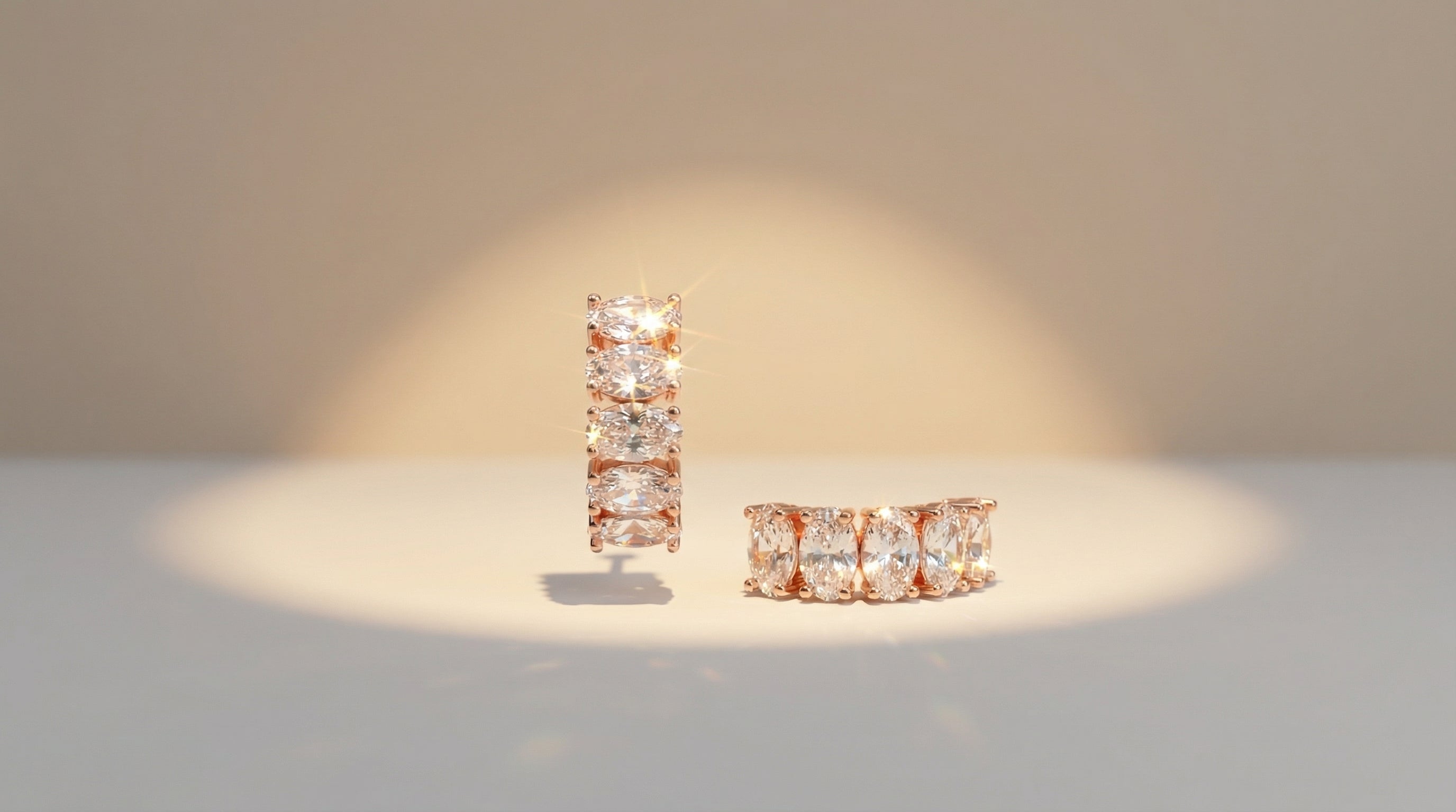 Pair of diamond earrings on a light background