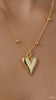 Luxe Gold Heart Pendant Necklace – Premium Elegant Chain showcasing a polished gold heart charm on a delicate beaded chain.