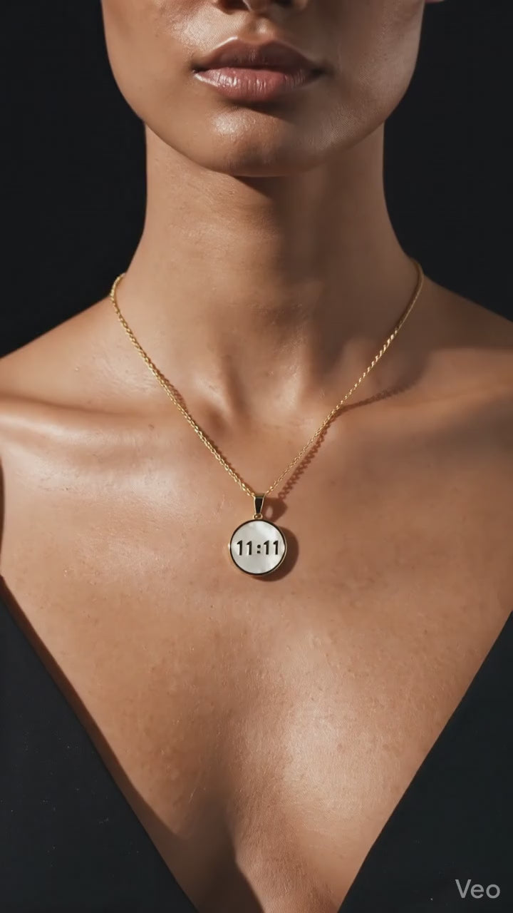 ZOMARA 11:11 Angel Number round mother-of-pearl pendant on gold-tone chain displayed on branded jewellery card