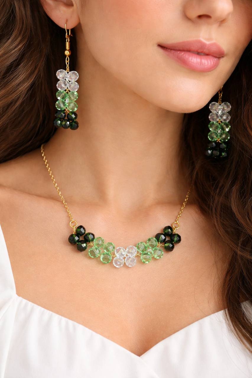 Green crystal necklace and earrings set with sparkling beads and gold plating by ZOMARA
