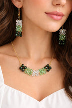 Green crystal necklace and earrings set with sparkling beads and gold plating by ZOMARA